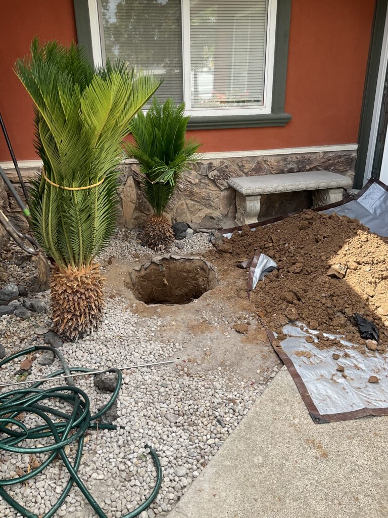 Hole dug for installation of clean out